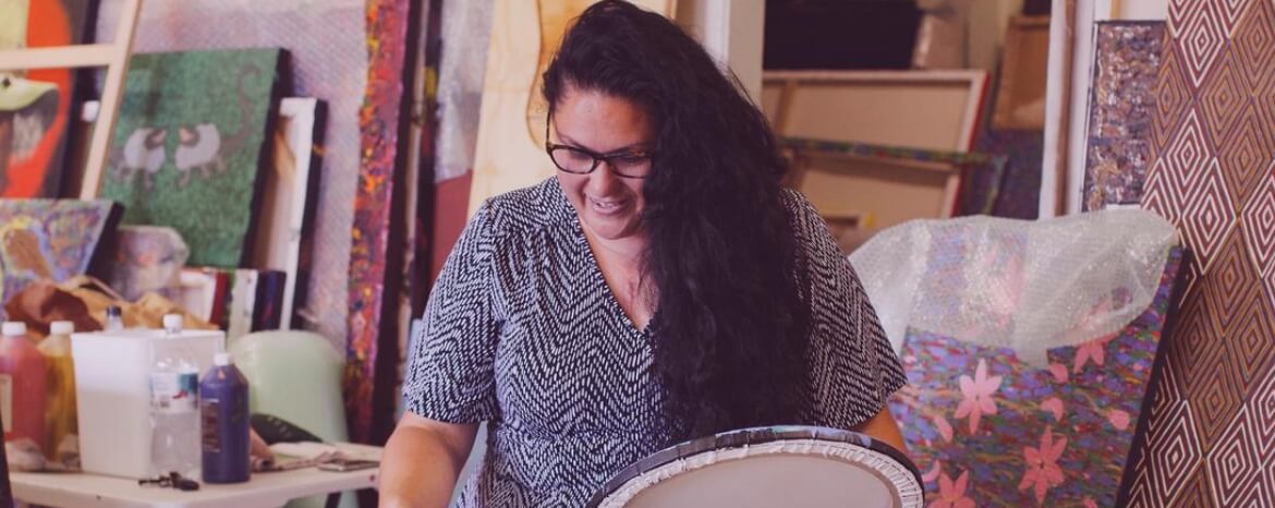 Indigenous woman painting