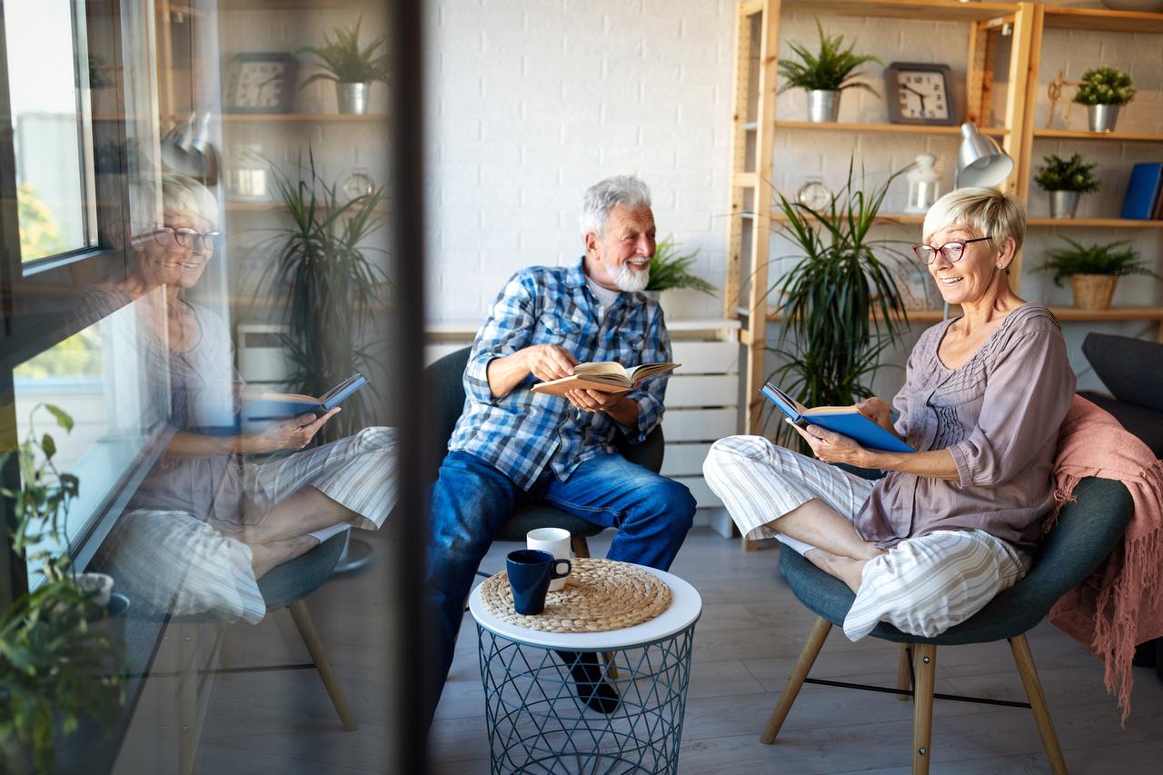 Older couple relaxing on their balcony