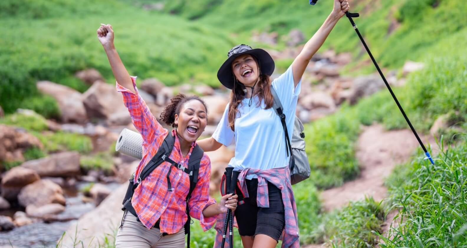Women on a hike near creek