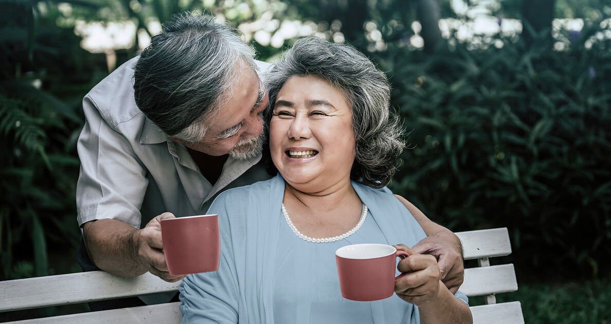 Old couple having coffee together