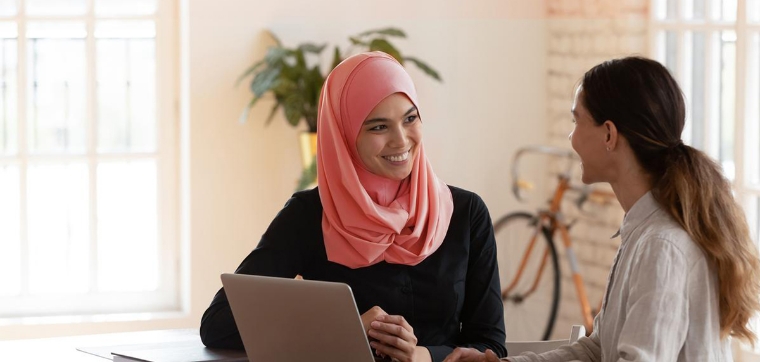 People looking at laptop